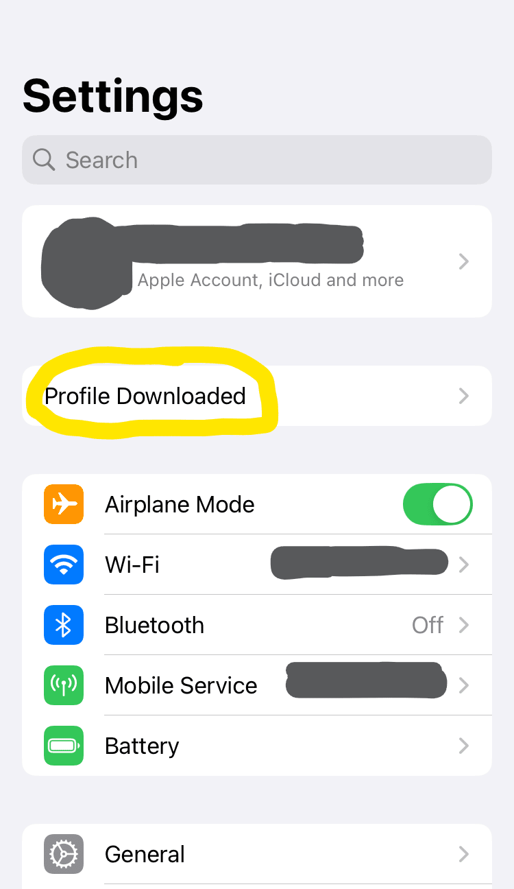 iPhone system settings, Profile Downloaded is circled.